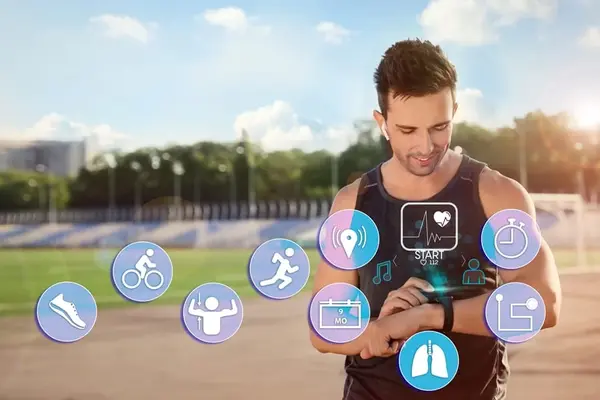 A young man in a park, doing sports and wearing modern electronic devices and smart gadgets